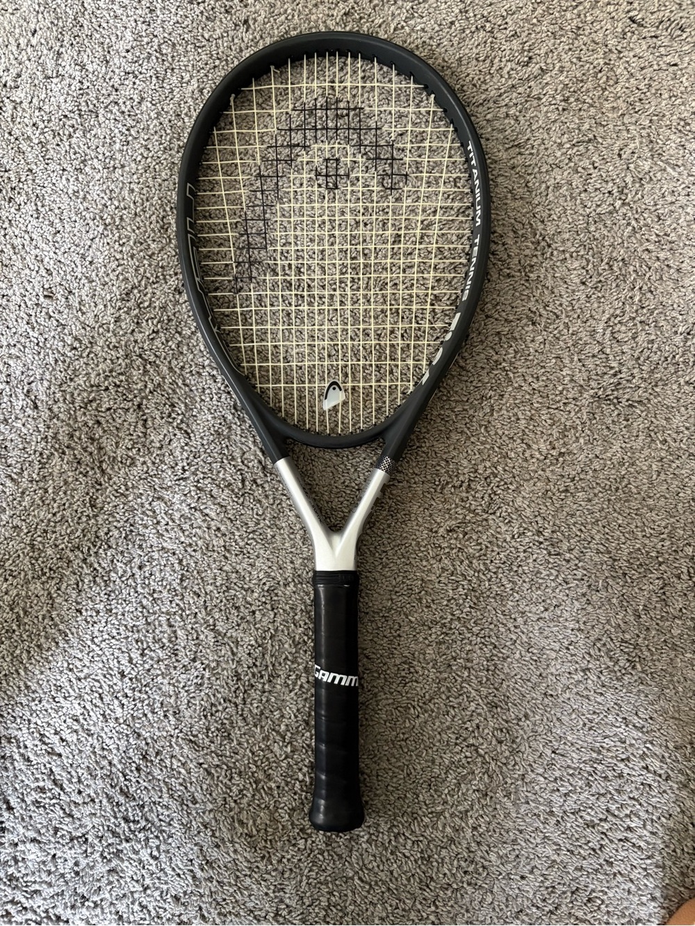 Head Black and Silver Tennis Racquet with Neutral Strings